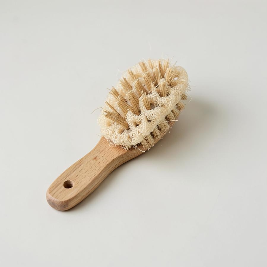 Wooden dish brush with plant fibre bristles and a loofah pad
