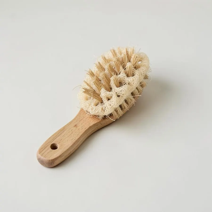 Wooden dish brush with plant fibre bristles and a loofah pad