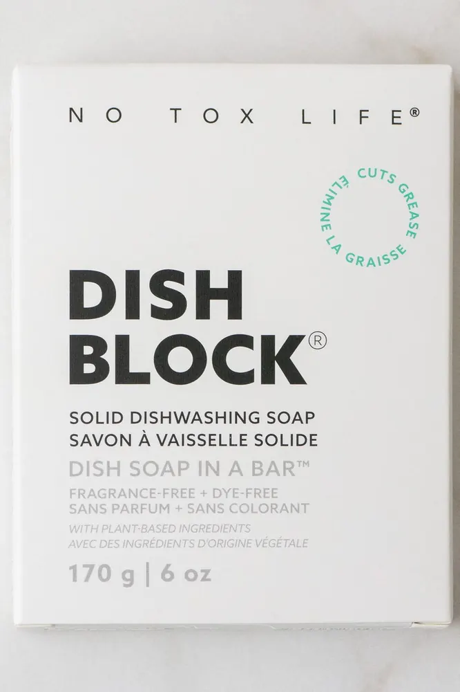 Solid dish washing soap block in cardboard packaging